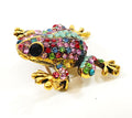 Gold-tone frog brooch adorned with multicolored rhinestones and a black gemstone eye.